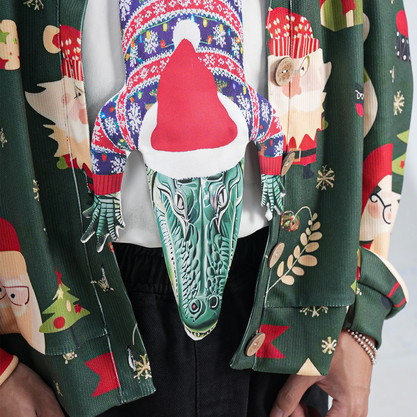 Novelty Christmas tie featuring an alligator wearing a Santa hat and holiday sweater, fun animal-themed festive accessory.
