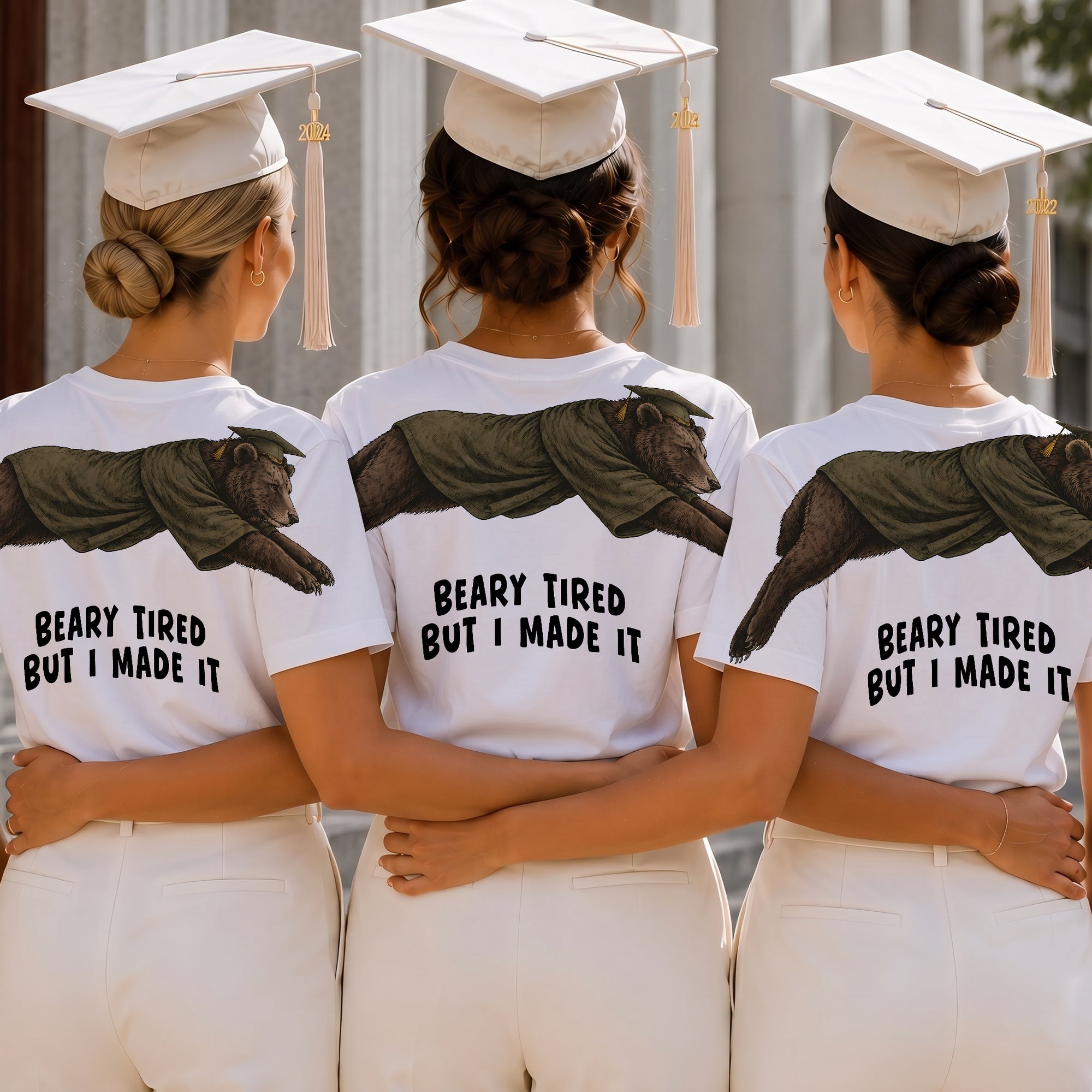 Bear Beary Tired But I Made It graduation graphic tee by Dripvity, unisex oversized white t-shirt with leaping bear in graduation cap and gown