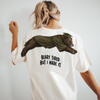 Bear Beary Tired But I Made It graduation graphic tee by Dripvity, unisex oversized white t-shirt with leaping bear in graduation cap and gown