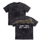 Bear Beary Tired But I Made It graduation graphic tee by Dripvity, unisex oversized white t-shirt with leaping bear in graduation cap and gown