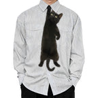 Novelty necktie featuring a realistic black cat appearing to hang from the wearer's collar