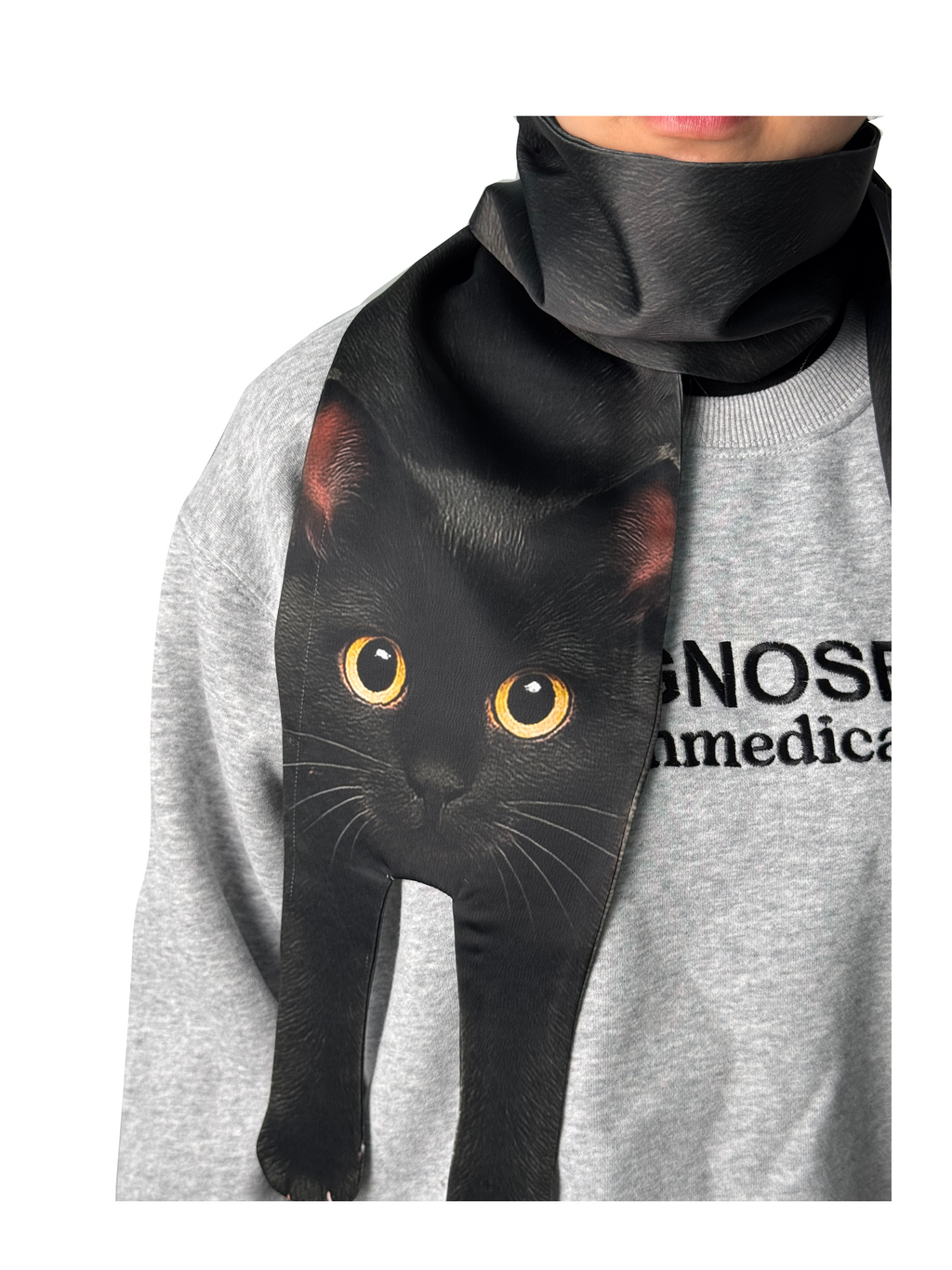 Unique novelty scarf featuring a realistic black cat design with yellow eyes, a creative and fun fashion accessory.