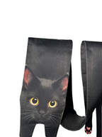 Unique novelty scarf featuring a realistic black cat design with yellow eyes, a creative and fun fashion accessory.