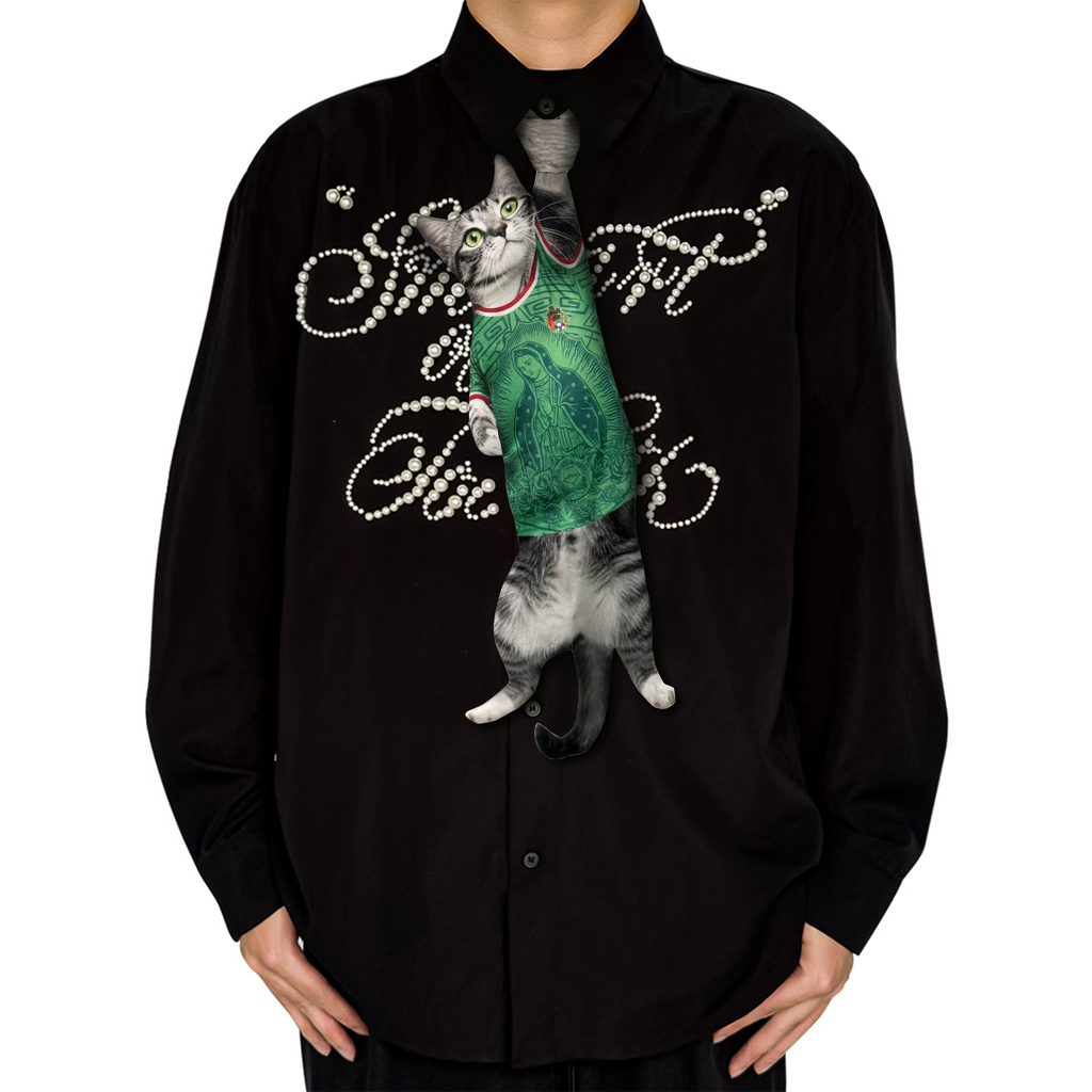 Novelty necktie featuring a realistic hanging grey cat wearing a green jersey with detailed graphic prints, a unique and playful fashion accessory.