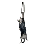 Novelty necktie featuring a realistic hanging grey cat wearing a black jersey with detailed graphic prints, a unique and playful fashion accessory.
