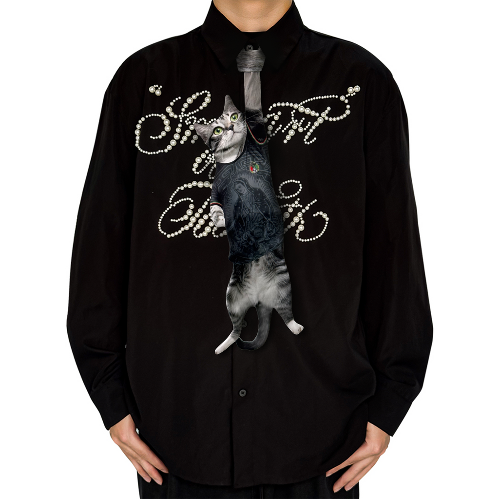 Novelty necktie featuring a realistic hanging grey cat wearing a black jersey with detailed graphic prints, a unique and playful fashion accessory.