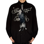 Novelty necktie featuring a realistic hanging grey cat wearing a black jersey with detailed graphic prints, a unique and playful fashion accessory.