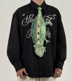 Unique chameleon-shaped novelty tie, a creative and artistic fashion accessory for standout outfits.