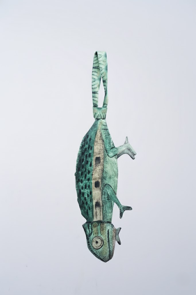 Unique chameleon-shaped novelty tie, a creative and artistic fashion accessory for standout outfits.
