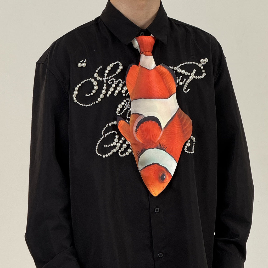 Fun clownfish-shaped novelty tie, a unique and colorful fashion accessory for ocean lovers and creative outfits.
