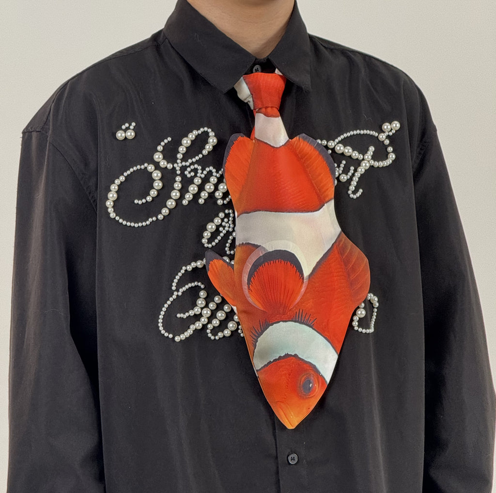 Fun clownfish-shaped novelty tie, a unique and colorful fashion accessory for ocean lovers and creative outfits.