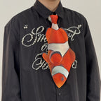 Fun clownfish-shaped novelty tie, a unique and colorful fashion accessory for ocean lovers and creative outfits.
