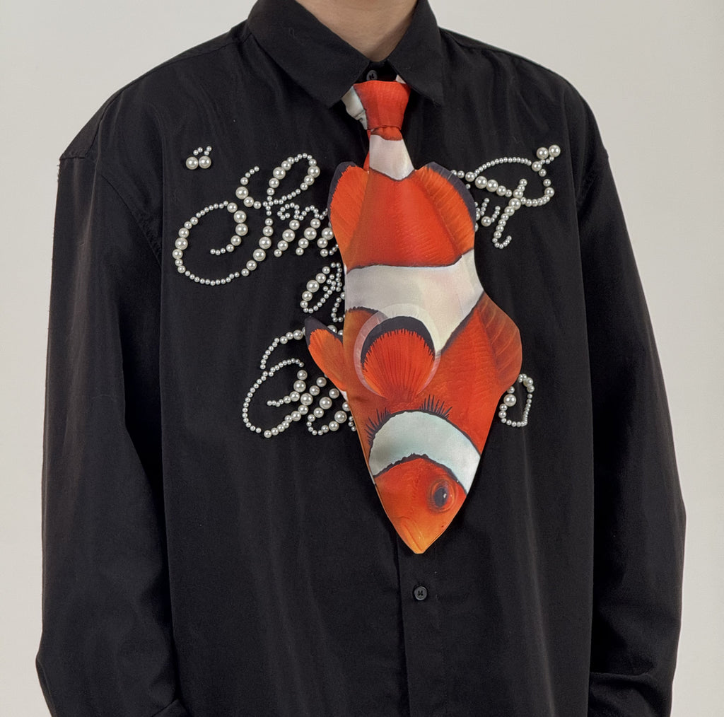 Fun clownfish-shaped novelty tie, a unique and colorful fashion accessory for ocean lovers and creative outfits.