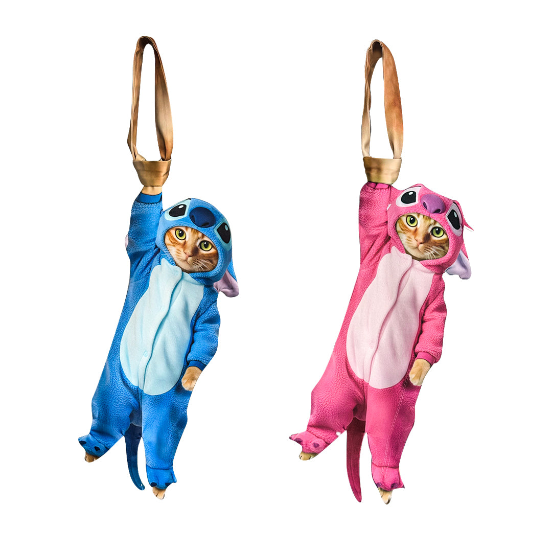 Novelty necktie featuring a cute hanging cat wearing blue and pink Stitch-style costume onesies, a playful and unique fashion accessory.