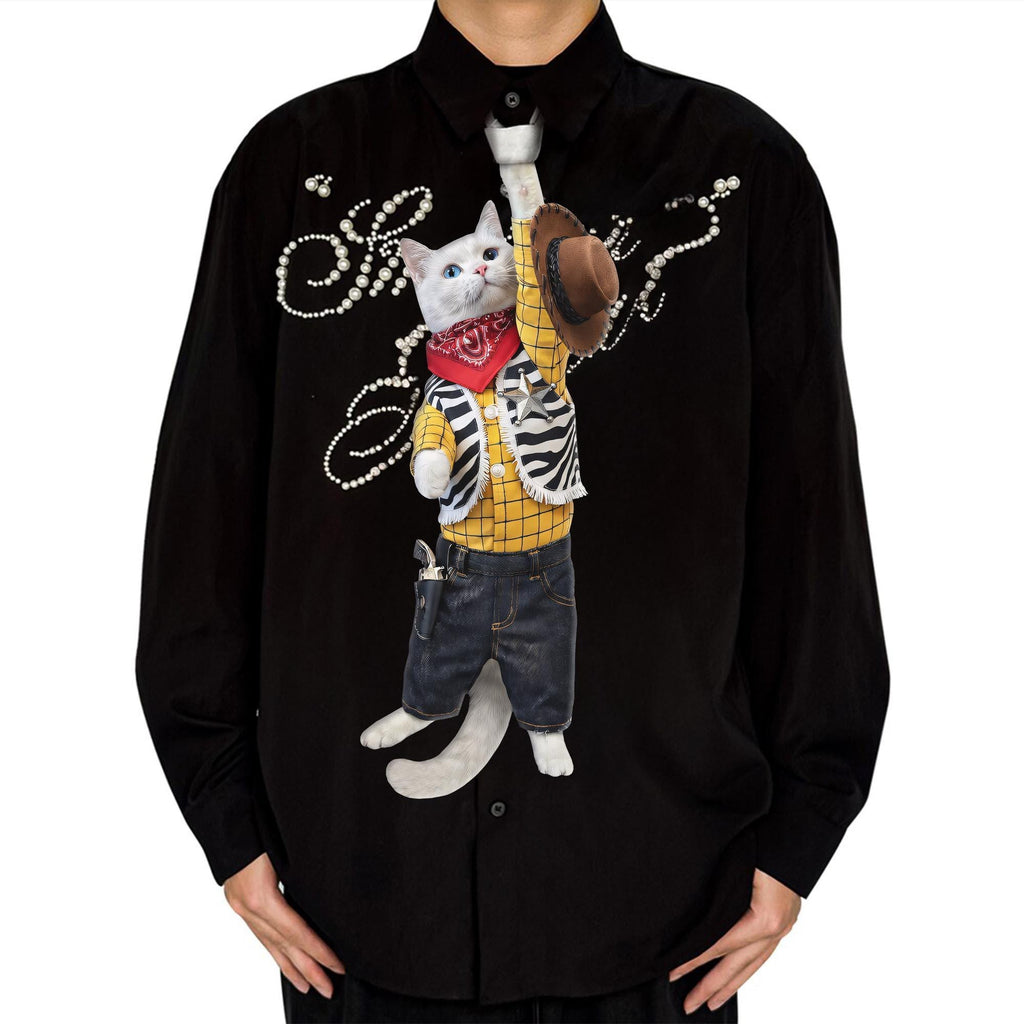 "Novelty necktie featuring a white cat dressed as a cowboy, wearing a yellow plaid shirt, vest, jeans, bandana, and holding a hat