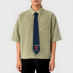 A dark blue custom necktie featuring the names 'JACK' and 'LYLY' embroidered with a red heart icon in the center, designed as a personalized gift