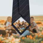 A set of one red and one black necktie, each featuring a custom-printed family photograph at the bottom tip, presented as a personalized gift option.