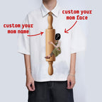Novelty necktie featuring a graphic print of a person, dressed in an apron, hugging a wooden rolling pin. Text on the rolling pin reads 'Mrs. Smith