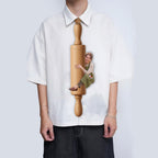 Novelty necktie featuring a graphic print of a person, dressed in an apron, hugging a wooden rolling pin. Text on the rolling pin reads 'Mrs. Smith