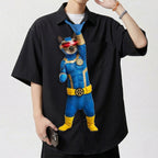 Novelty necktie featuring a Siamese cat dressed in a blue and gold superhero costume with a red visor, inspired by the character Cyclops