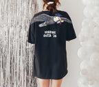Eagle Soaring Outta 26 graduation graphic tee by Dripvity, unisex oversized white t-shirt with flying bald eagle in graduation cap and diploma