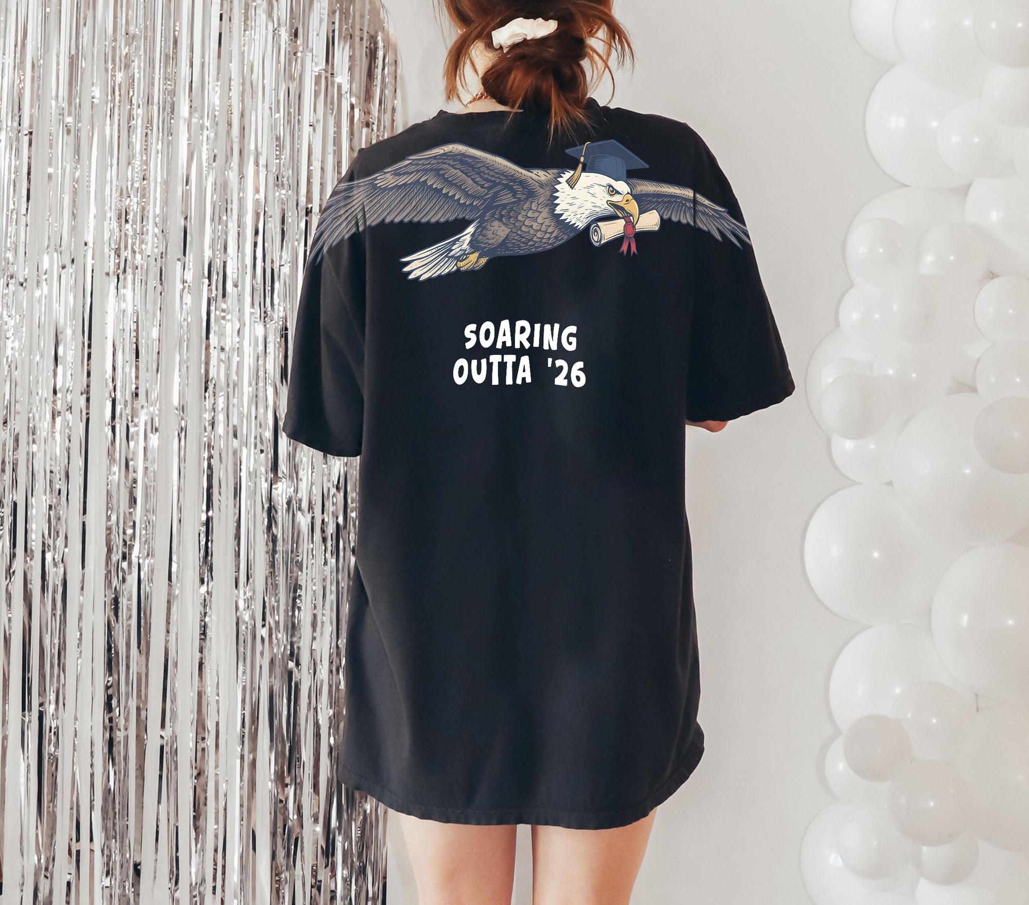 Eagle Soaring Outta 26 graduation graphic tee by Dripvity, unisex oversized white t-shirt with flying bald eagle in graduation cap and diploma