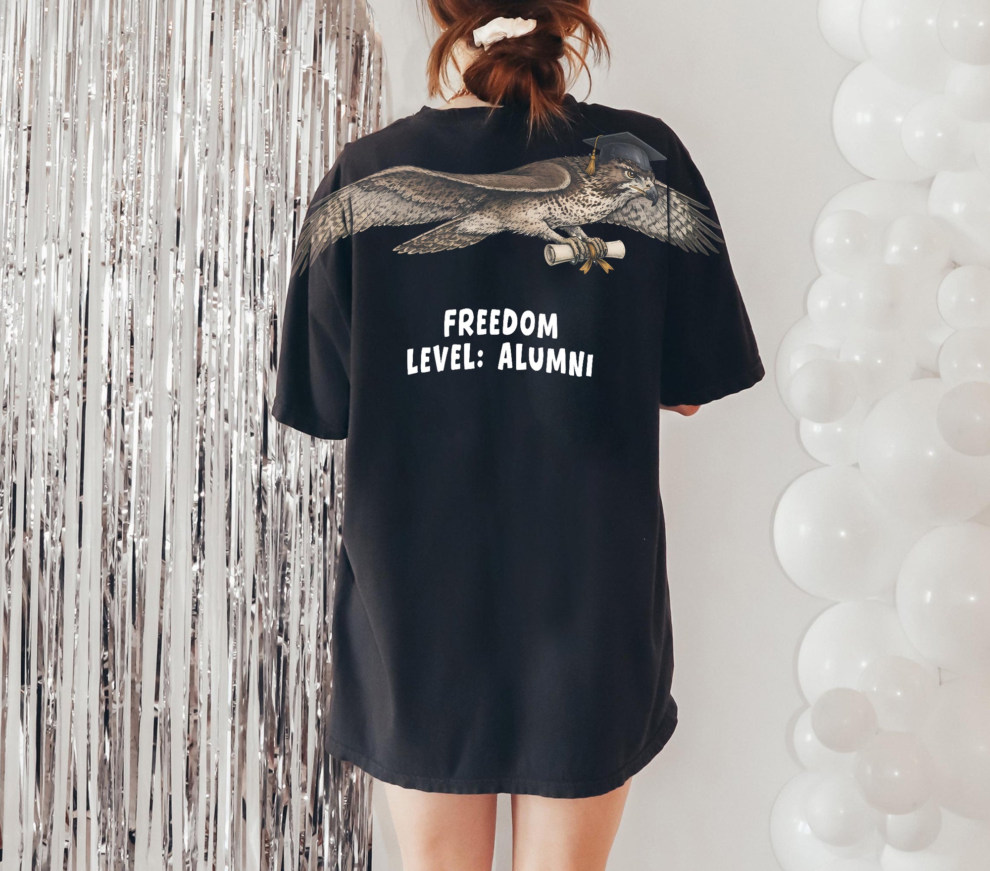 Eagle Soaring Outta 26 graduation graphic tee by Dripvity, unisex oversized white t-shirt with flying bald eagle in graduation cap and diploma