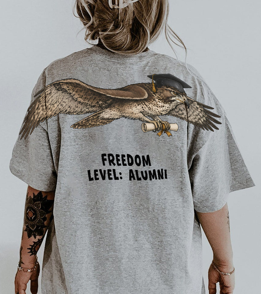 Eagle Soaring Outta 26 graduation graphic tee by Dripvity, unisex oversized white t-shirt with flying bald eagle in graduation cap and diploma