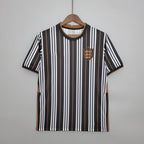 England Three Lions striped football jersey graphic tee by Dripvity, unisex oversized black and white streetwear t-shirt with iconic England crest
