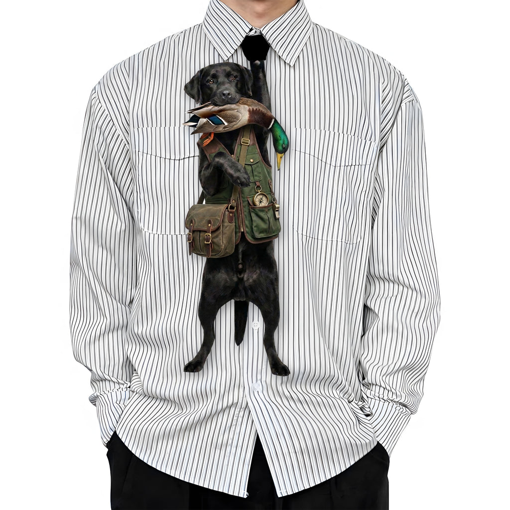 Novelty necktie featuring a black Labrador retriever dressed in a hunting vest, carrying a mallard duck in its mouth, appearing to hang from the wearer's collar