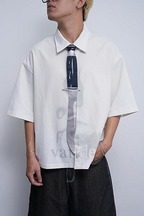 "Novelty necktie featuring a unique dagger design, a bold and edgy fashion accessory.