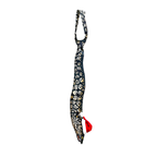 Eel-shaped novelty tie with a unique leopard print pattern and Santa hat, fun animal-themed festive accessory.