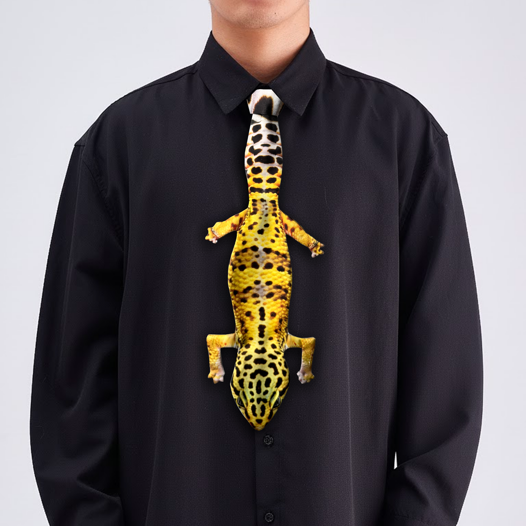 Novelty necktie featuring a realistic yellow and black spotted leopard gecko design, a unique and eye-catching fashion accessory.