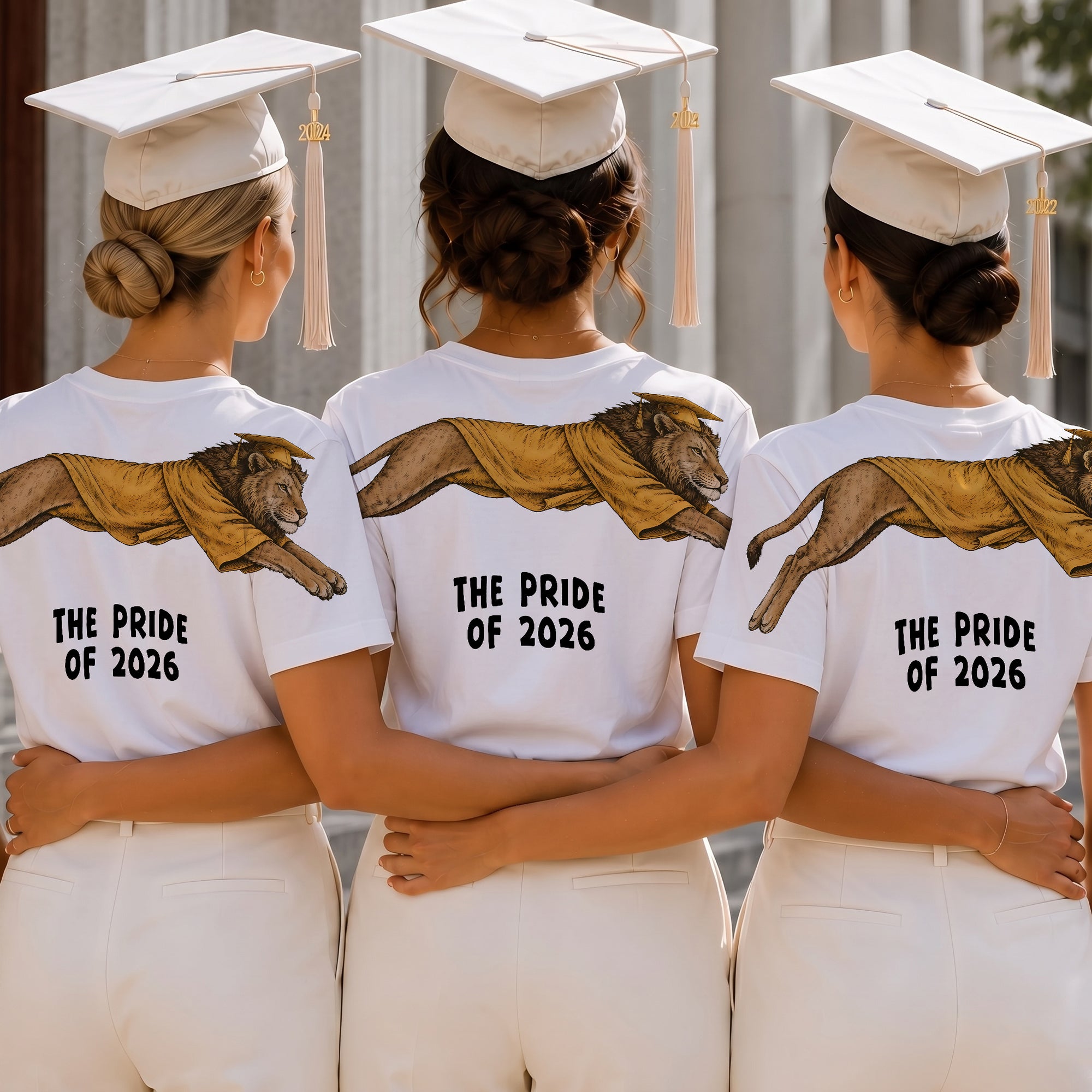 Lion The Pride of 2026 graduation graphic tee by Dripvity, unisex oversized white t-shirt with leaping lion in graduation cap and gown