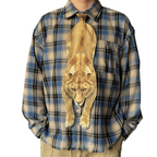 Novelty necktie featuring a realistic hanging lioness design, a bold and unique fashion accessory.