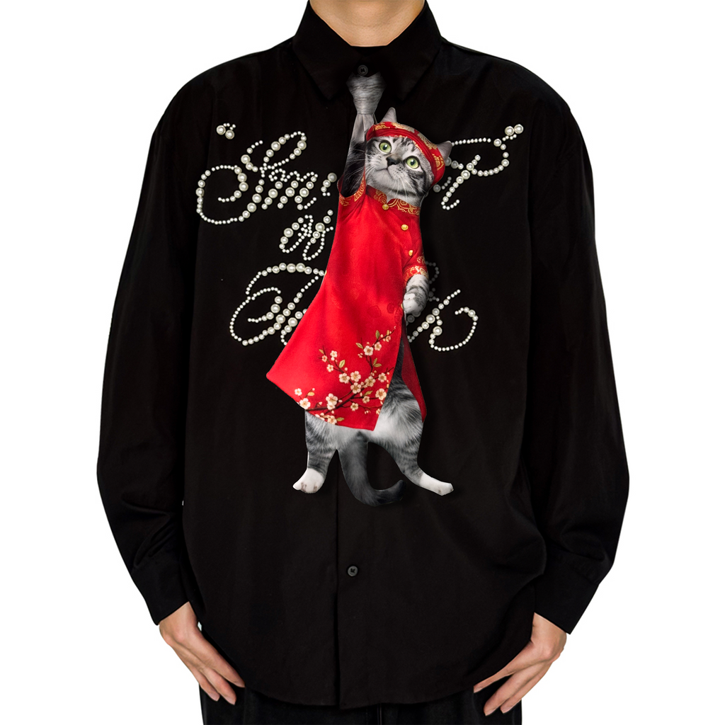 "Novelty necktie featuring a realistic hanging grey cat wearing a traditional red Vietnamese Ao Dai with floral patterns, a unique and festive fashion accessory."