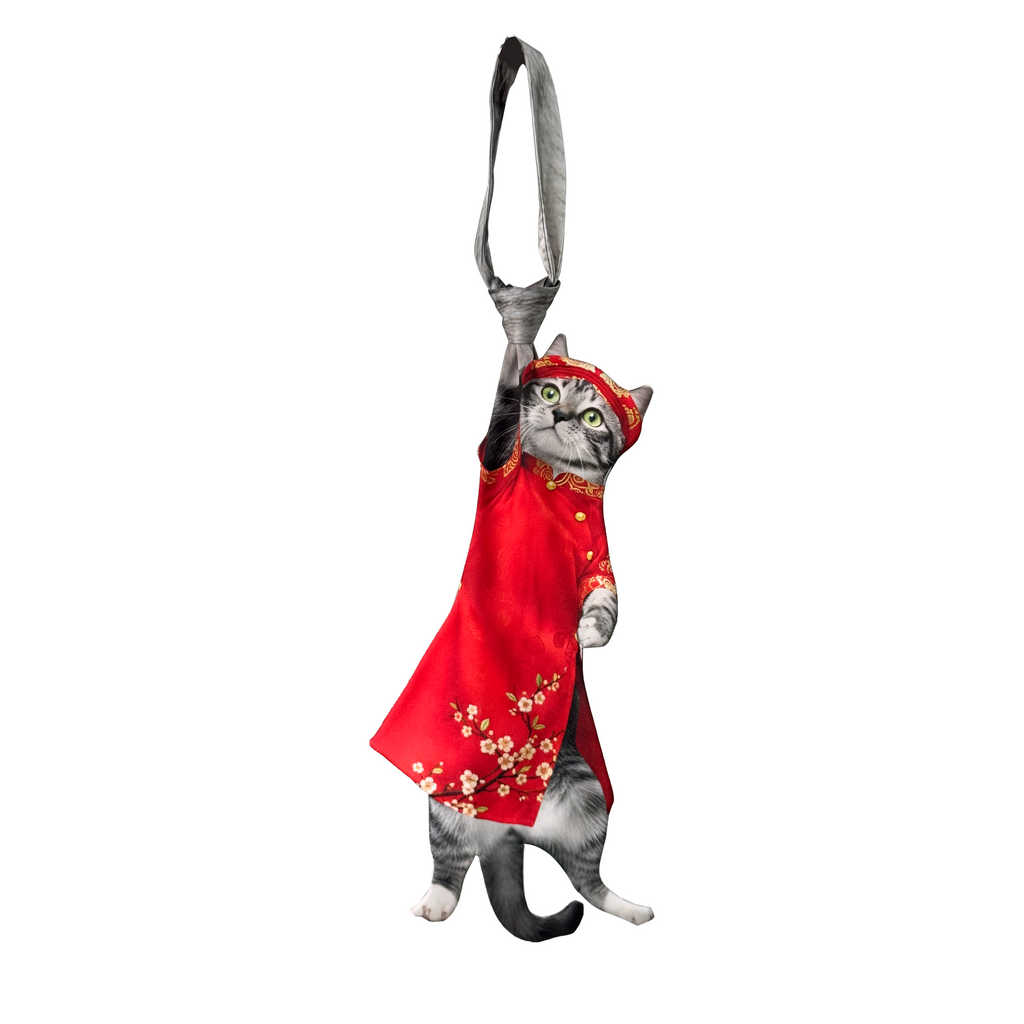 Novelty necktie featuring a realistic hanging grey cat wearing a traditional red Vietnamese Ao Dai with floral patterns, a unique and festive fashion accessory