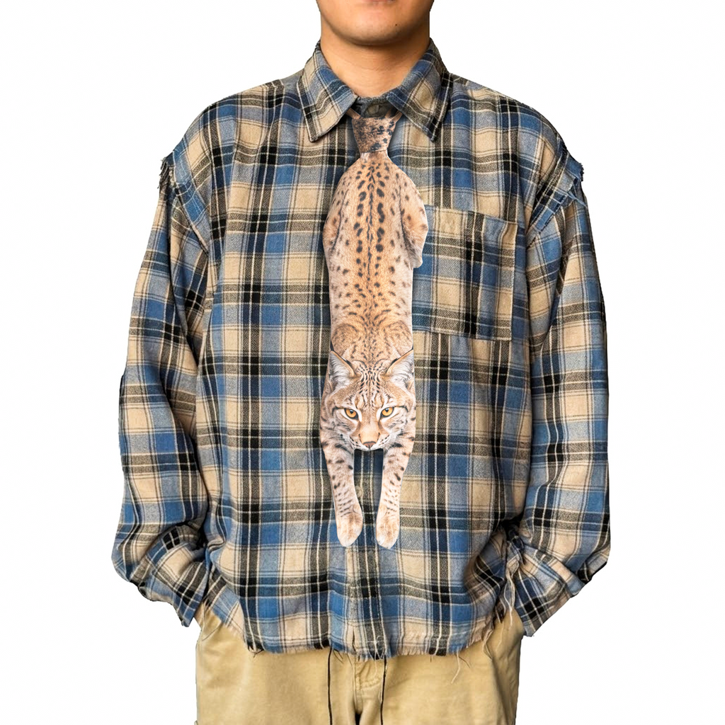 Novelty necktie featuring a realistic hanging lynx design, a unique and eye-catching fashion accessory.