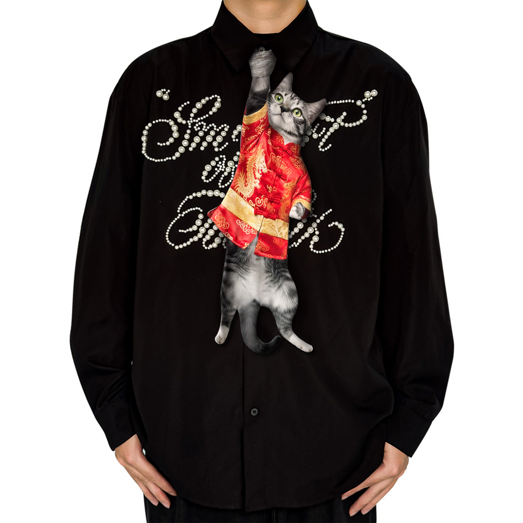Novelty necktie featuring a realistic hanging grey cat wearing a traditional red Tang suit with dragon embroidery, a unique and festive fashion accessory.