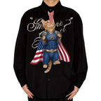 Novelty necktie featuring a ginger cat dressed in a blue tactical superhero suit with a paw print emblem and a cape designed like the American flag