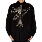 Novelty necktie featuring a cat dressed as a Peaky Blinders character, wearing a suit and flat cap, smoking a cigarette