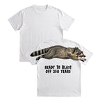 Raccoon ready to blast off 250 years graphic tee by Dripvity, unisex oversized black t-shirt with patriotic raccoon and fireworks design