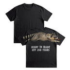 Raccoon ready to blast off 250 years graphic tee by Dripvity, unisex oversized black t-shirt with patriotic raccoon and fireworks design