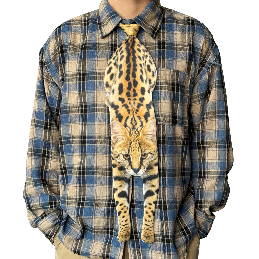 Novelty necktie featuring a realistic hanging Serval cat design, a unique and eye-catching fashion accessory.