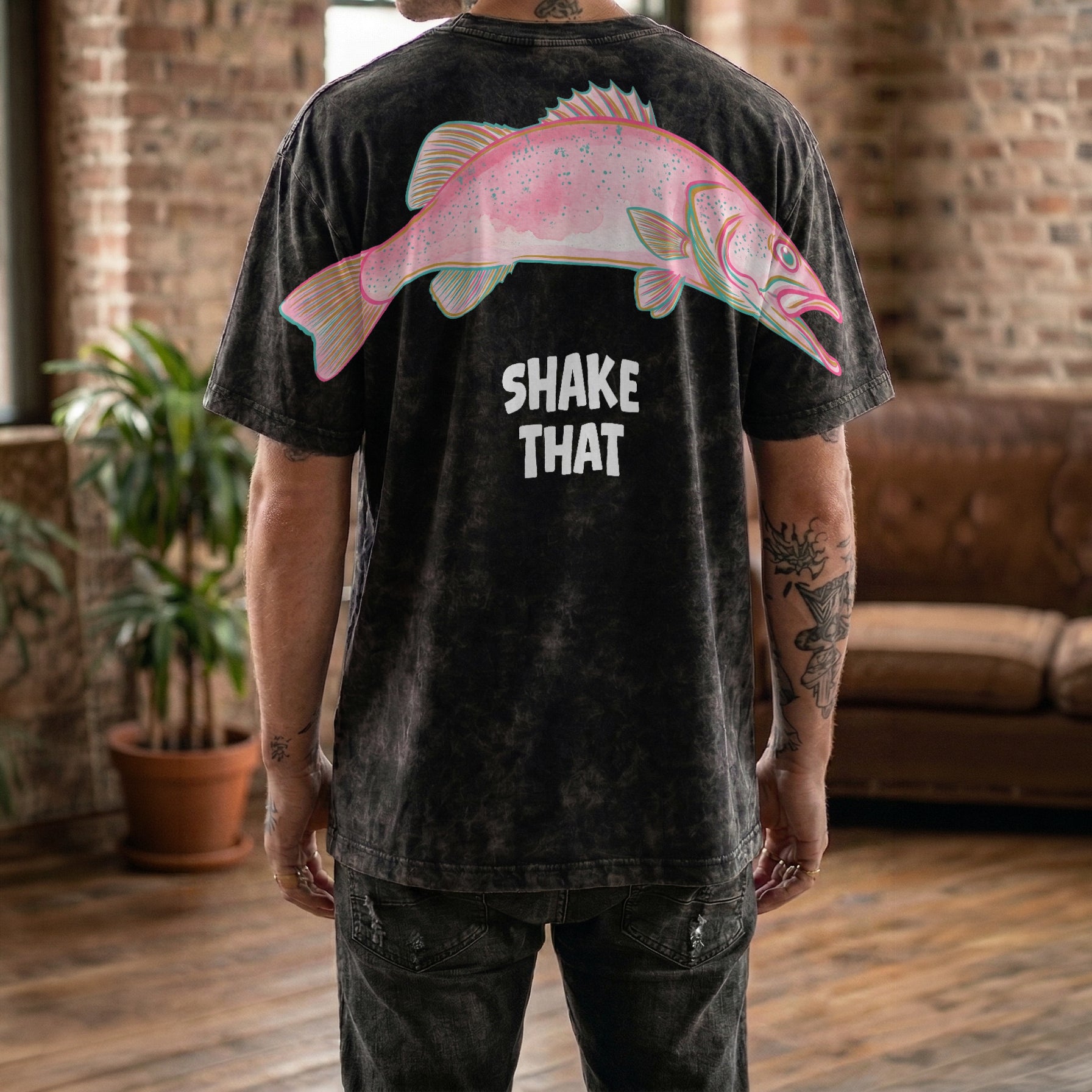 Shake That fish graphic tee funny streetwear by Dripvity, unisex oversized white t-shirt with colorful pink fish and bold text design