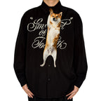 Novelty necktie featuring a realistic hanging Shiba Inu dog design, a fun and unique fashion accessory for dog lovers.