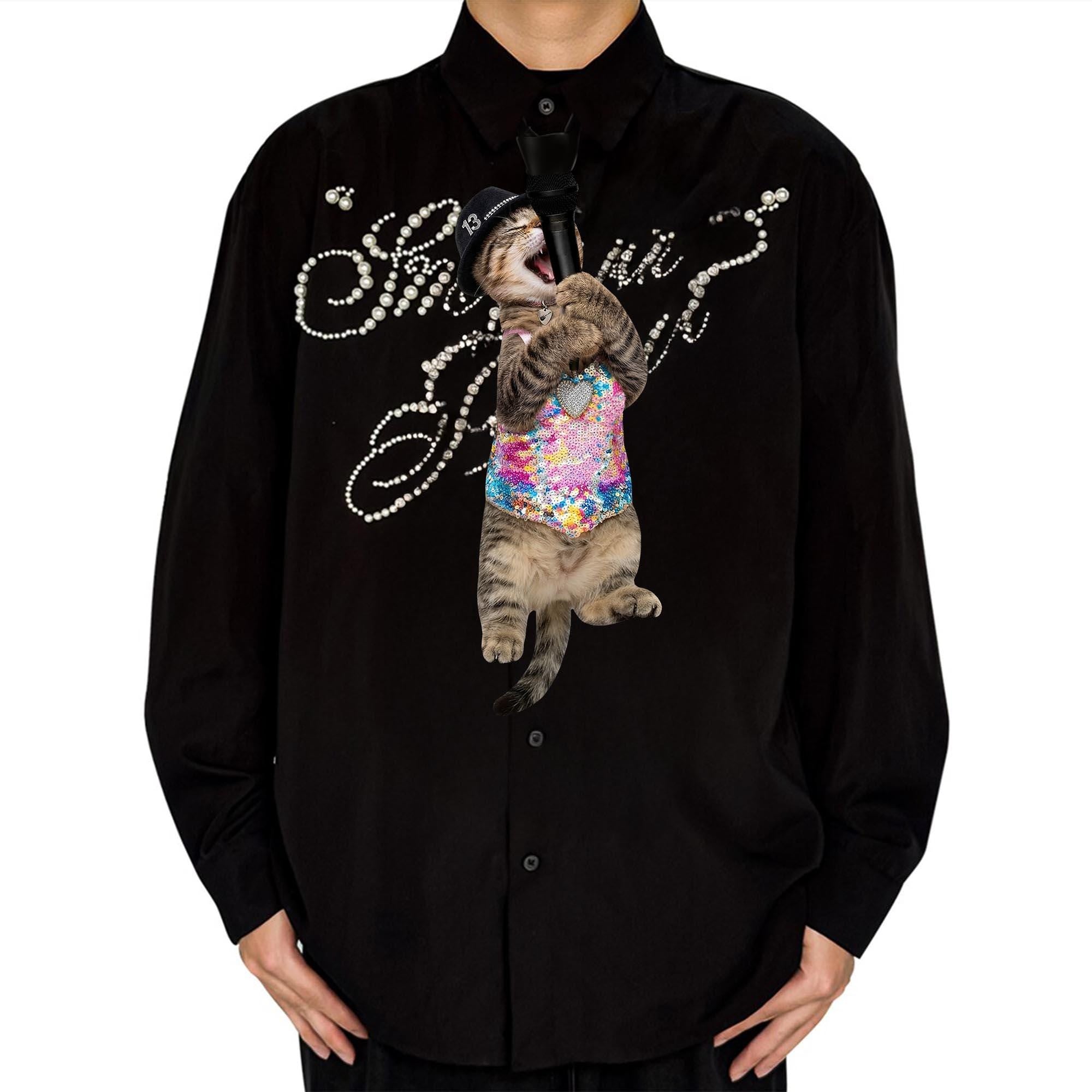 Novelty necktie featuring a cat singing into a microphone, wearing a sparkly, colorful outfit and a small hat