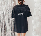 Slipping Outta 26 Panther Graduation Graphic Tee By Dripvity. Edgy unisex oversized black washed t-shirt with leaping panther in graduation cap. Perfect 2026 senior graduation streetwear gift. Shop now!
