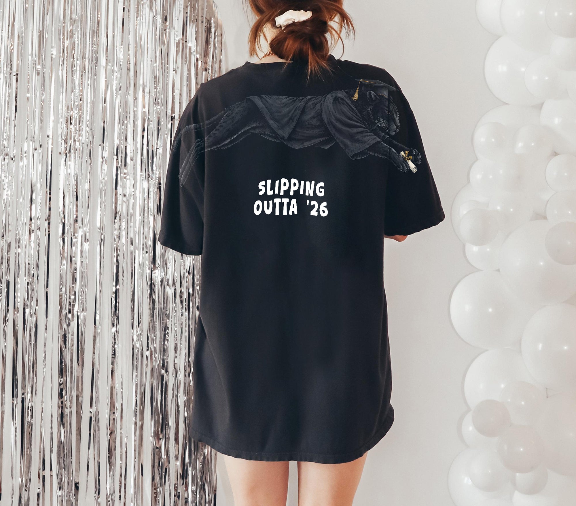 Slipping Outta 26 Panther Graduation Graphic Tee By Dripvity. Edgy unisex oversized black washed t-shirt with leaping panther in graduation cap. Perfect 2026 senior graduation streetwear gift. Shop now!