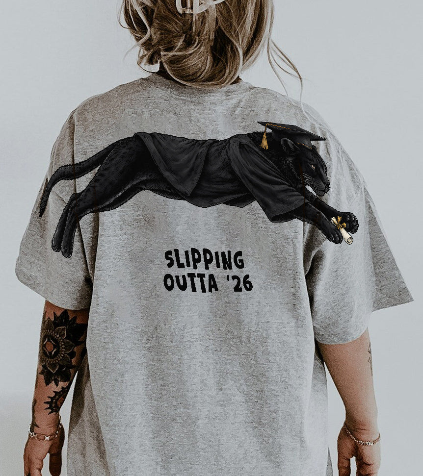 Slipping Outta 26 Panther Graduation Graphic Tee By Dripvity. Edgy unisex oversized black washed t-shirt with leaping panther in graduation cap. Perfect 2026 senior graduation streetwear gift. Shop now!